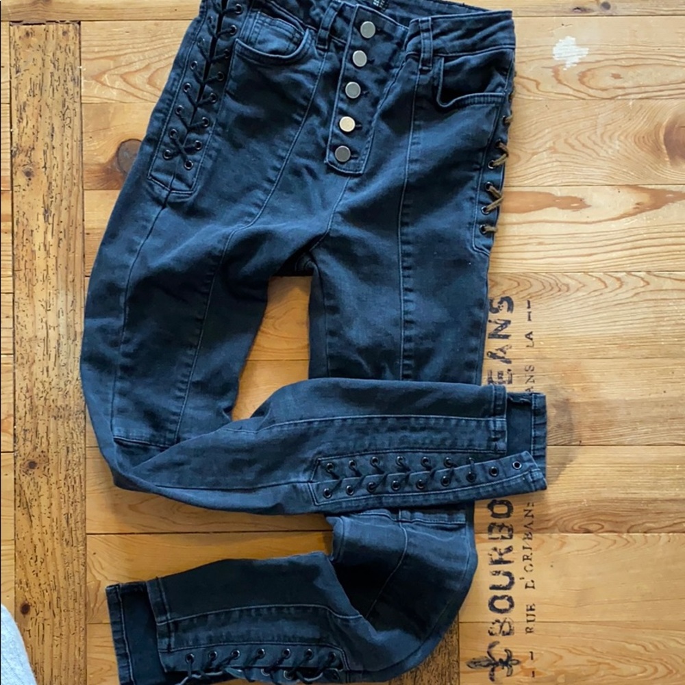 asymmetrical black button fly cropped lace up jeans